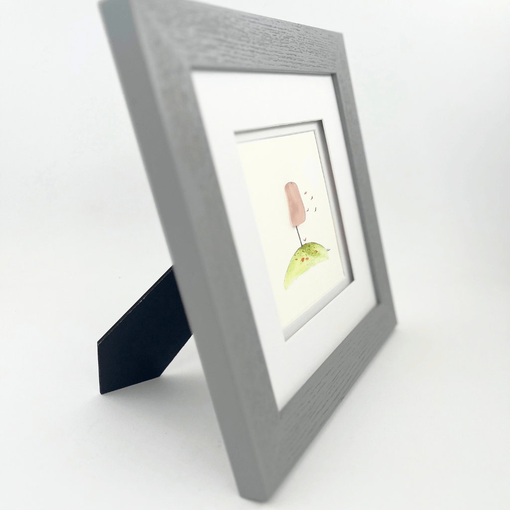 Side view of The Breast Cancer Tree framed original artwork featuring Depression era rose glass.
