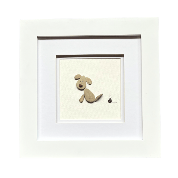 Framed pebble dog artwork titled “I’m Sorry,” displayed in an 8×8 white wood frame.
