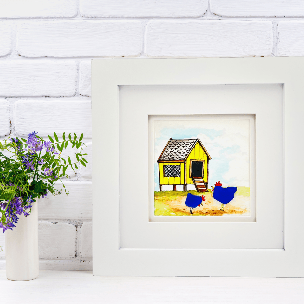 Framed Blue Chickens & The Yellow Coop Aroostook River Illustration displayed beside purple flowers