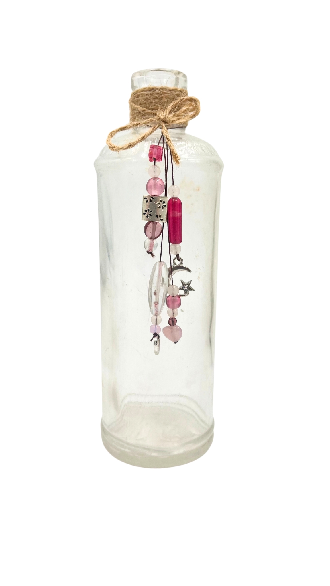 Upcycled LF glass bottle found in the Aroostook River, decorated with pink beads, charms, and twine