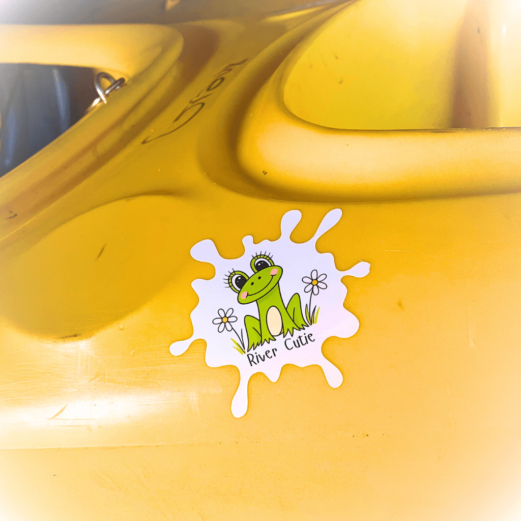 River Cutie sticker on a yellow kayak.