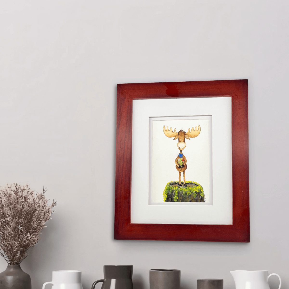 Framed You’re My Maine Squeeze artwork by Riverbed Art displayed on a neutral wall above pottery decor, showing its warm Maine-inspired charm.