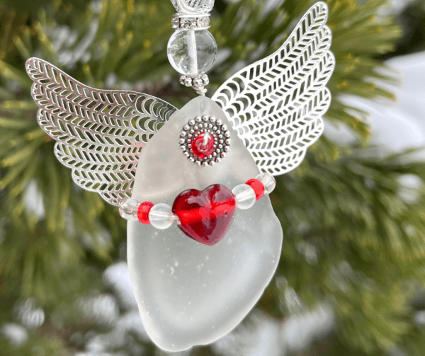 Aroostook River Angel Heart of Glass hanging on evergreen branch