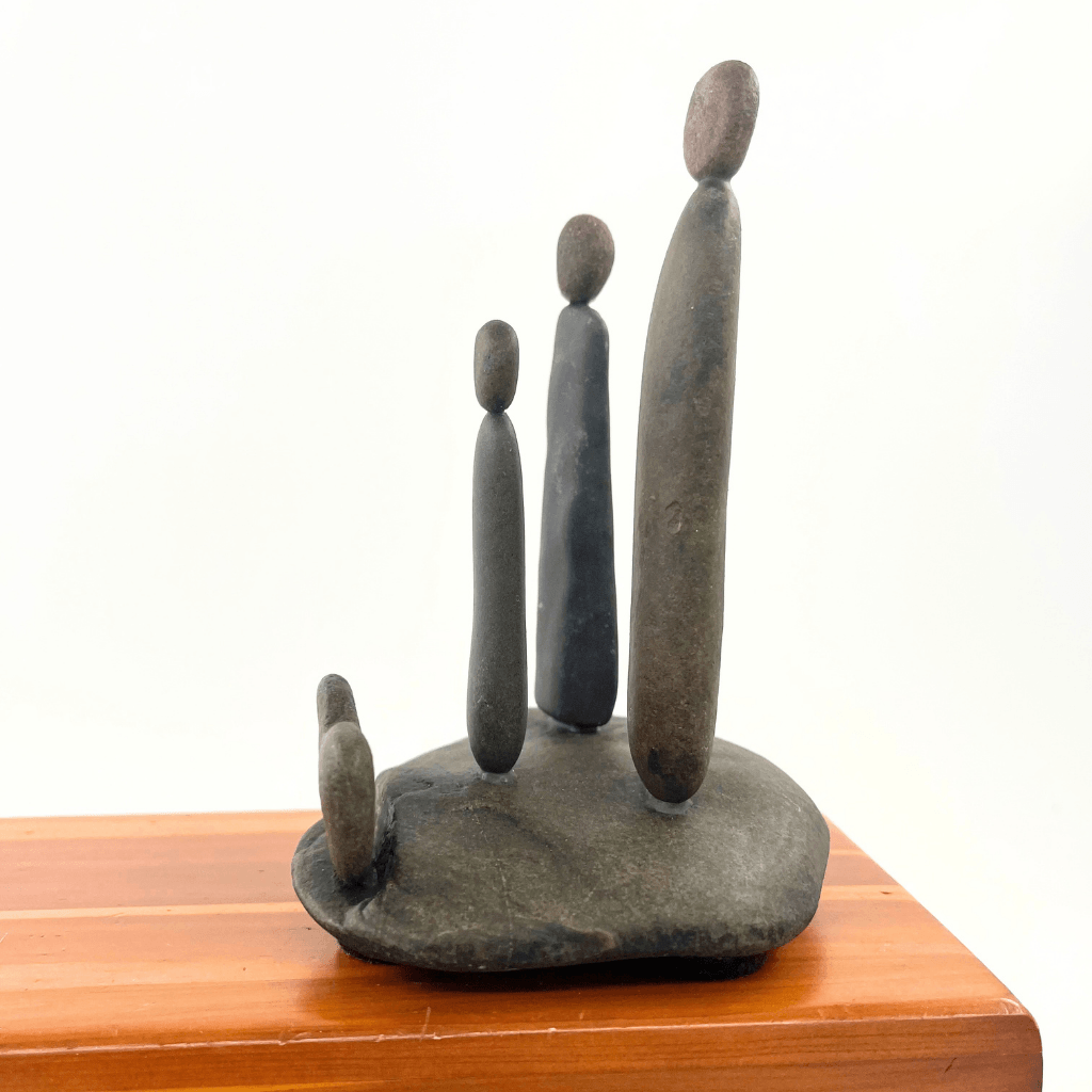 Side view of Family & Love Aroostook River stone family sculpture