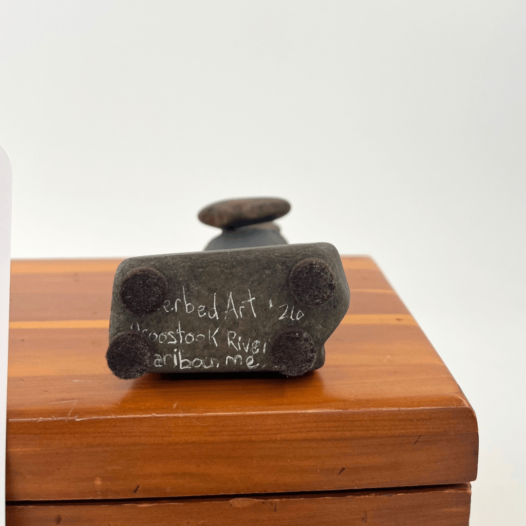 Underside of the stone base with four velvet feet and Riverbed Art signature, 2026 date, and Caribou, Maine inscription.