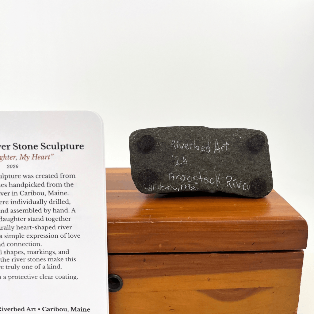 Underside of My Daughter, My Heart stone sculpture with Riverbed Art signature, 2026 date, Aroostook River inscription and four pads.