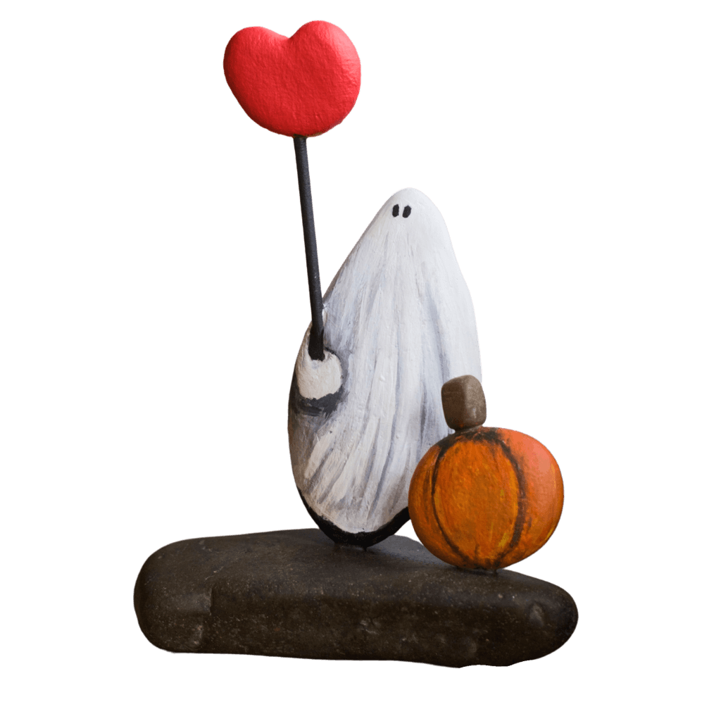 Pumpkin Patch Love stone sculpture featuring a white ghost holding a red heart beside an orange pumpkin.