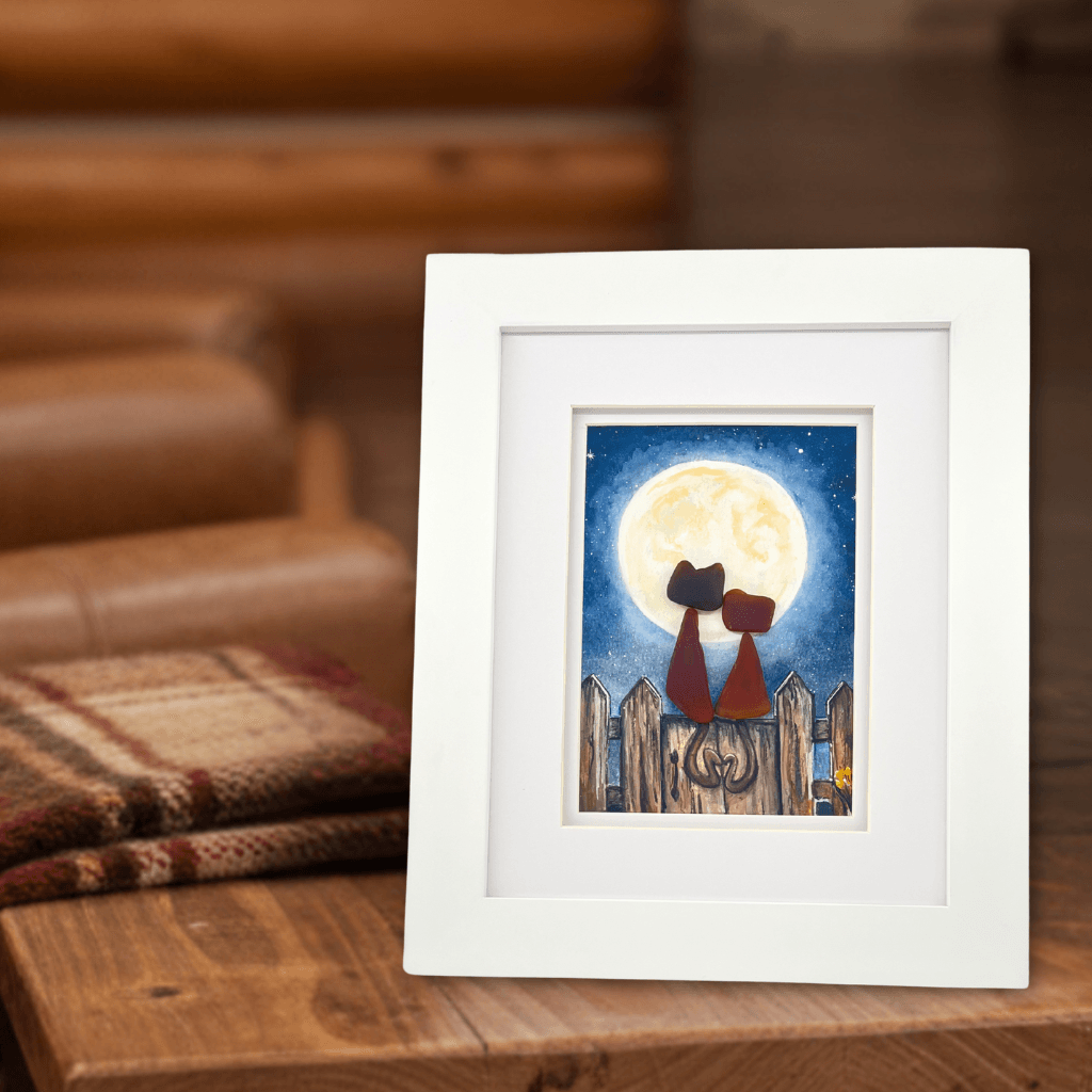 Framed Stray Cats original artwork displayed on a wood table
