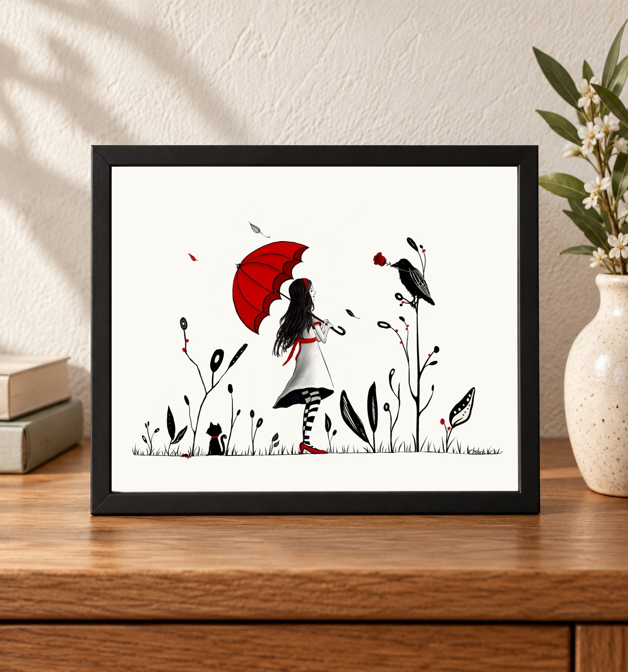 Red Things 8 × 10-inch landscape print displayed in a black frame on an oak table, showing the full original illustration and signature. Frame not included.