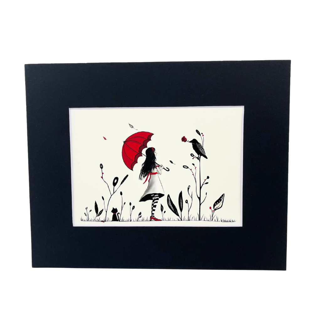 Red Things art print in a black mat on a white background, showing a girl with a red umbrella, a black cat, and a bird holding a red rose.